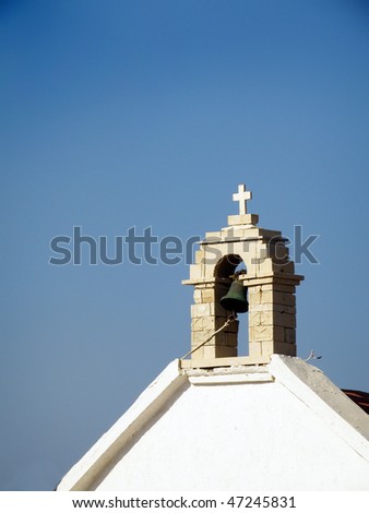 ringing bell on small Orthodox chapel on island of Crete