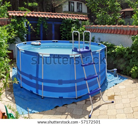 large above ground metal frame swimming pool in my back yard