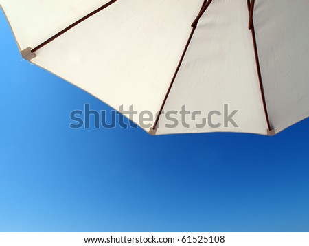 white parasol directly above