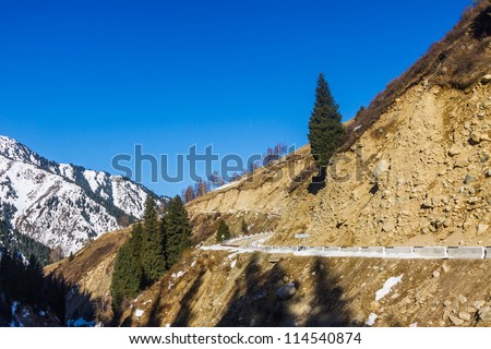 Road in winter mountains in Kazakhstan. Trans-Ili Alatau, North Tien Shan mountain system