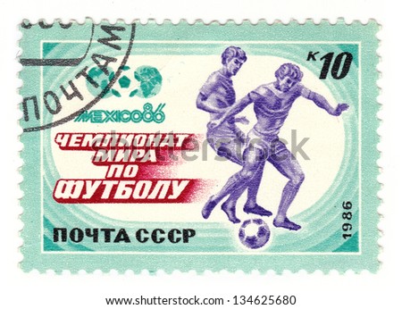 USSR - CIRCA 1986: A post stamp printed in USSR shows football players, series World Football Cup in Mexico, circa 1986