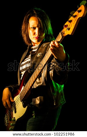 Rock Woman Playing Electric Bass Guitar