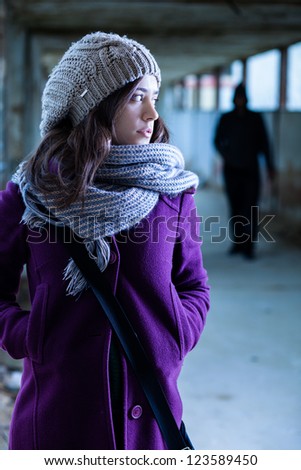 Worried Woman Stalked by a Man