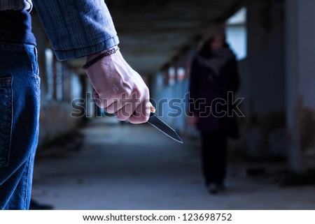 Criminal with Knife Waiting for a Woman