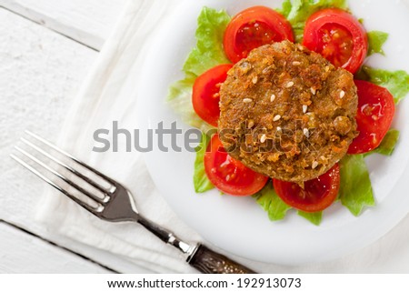 Vegetarian Lentil Burger with Tomatoes and Cabbage
