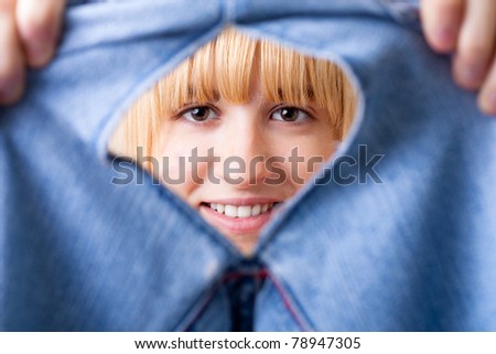 Smiling Woman with Torn Jeans