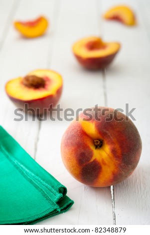 Clingstone Peaches on White Wooden Table with Green Napkin