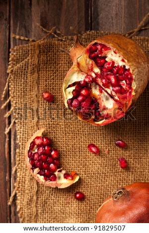 Pomegranate with Seeds on Jute and Wood