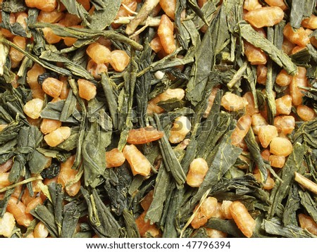 Japanese brown rice tea (green tea with roasted rice) - close up view, can be used as a background