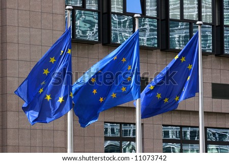 European flags floating in front of the European Council Building in Brussels