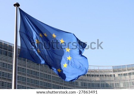 European flags floating in front of the European Commission Building in Brussels