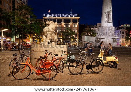 AMSTERDAM - AUGUST 21: Dam Square at Night on August 21, 2012 in Amsterdam, Netherlands. Notable buildings and frequent events in Dam Square make it one of the most important locations in the city.