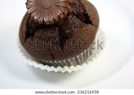 chocolate muffin with chocolate flower decoration