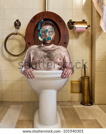 stock-photo-bizarre-man-with-goggles-swimming-in-vintage-toilet-101940301.jpg