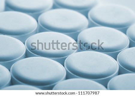 Many medical pills. Toned in blue