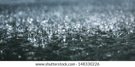 Drops Of Heavy Rain On Water