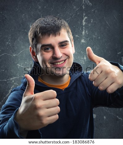 Young man giving thumb up