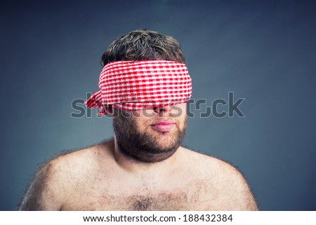 Portrait of the  man blindfold , isolated on gray