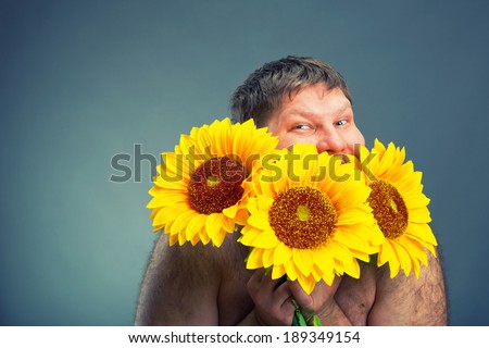 Portrait of man with bouquet  sunflowers