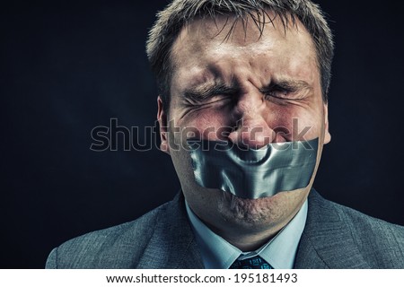 Man with mouth covered by masking tape