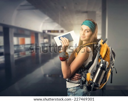 Happy traveler woman is waiting for a flight