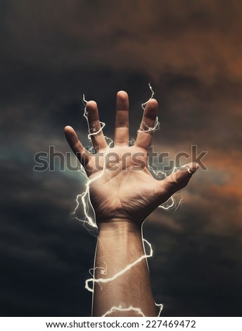 Lightning around men\'s hand