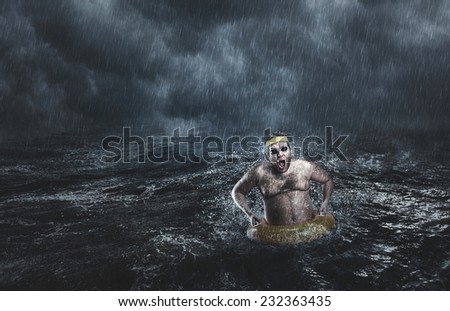 Man in the sea while storming