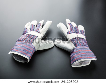 Work glove against grey