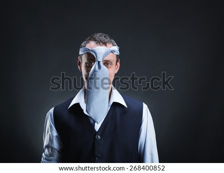 Strange man with necktie on his head
