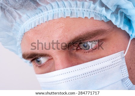 Serious doctor\'s glance