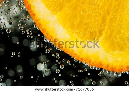 stock photo Closeup of a wet juicy orange slice