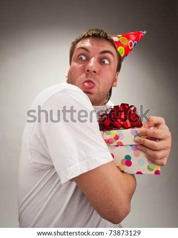 Birthday Funny Images on Funny Birthday Man With Gift Making Face Stock Photo 73873129