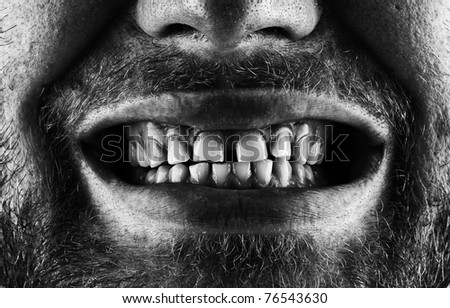 Close-up of a scary screaming bearded mouth