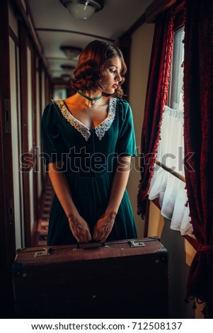 Railway journey woman in vintage train compartment
