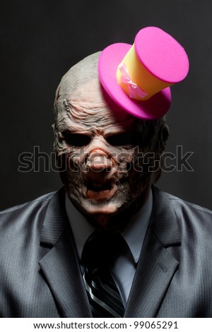 Sad monster in business suit with funny pink hat