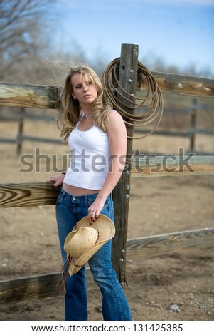 Young cute country girl outdoors on the farm in Colorado