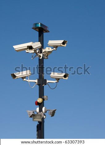 Cluster of security cameras at entrance to secure area.