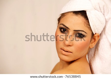 Female with towel wrapped after taking bath