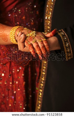 stock photo Close up of Asian couple's hands at a wedding