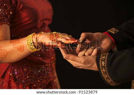 stock photo Close up of Arab couple's hands at a wedding 