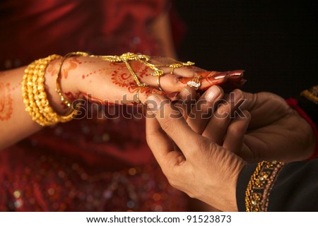Close up of Pakistani couple\'s hands at a wedding, concept of marriage/partnership/commitment