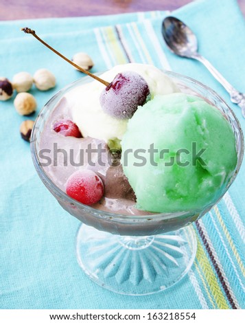 Fresh fruit ice cream with raspberry and cherry
