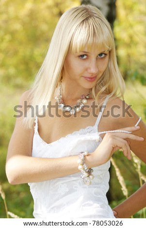 Portrait charming young woman in summer solar day