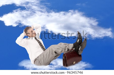 Businessman over white cloud