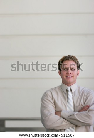 business man against wall with horizontal lines