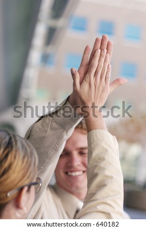 man and woman high five