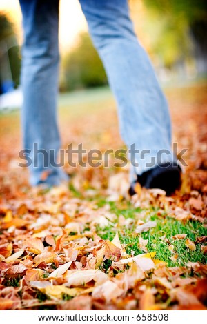 woman walking in the leaves