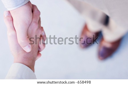 man and woman shake hands