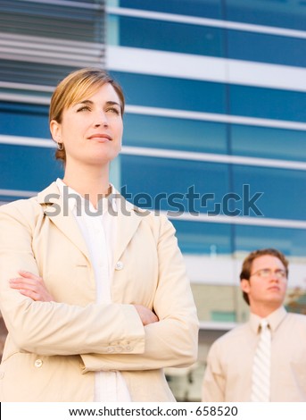businessman and woman looking in the same direction