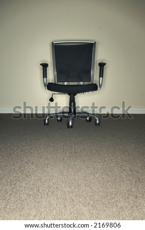 Black and Gray office chair in the office with copy space in front of the chair